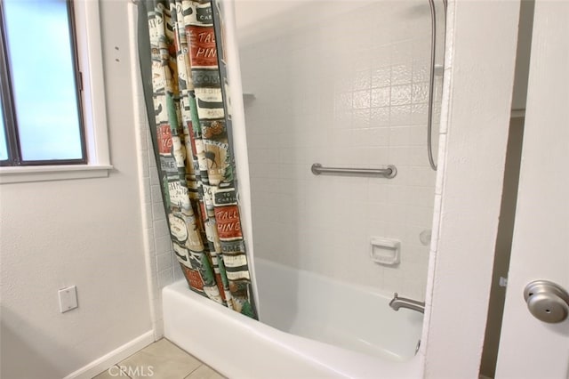 bathroom featuring tile patterned floors and shower / bath combo with shower curtain