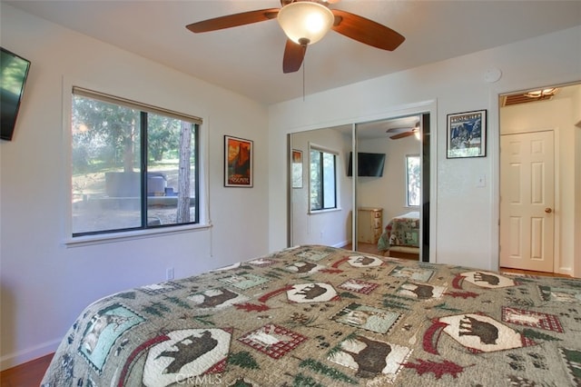 bedroom featuring ceiling fan and a closet