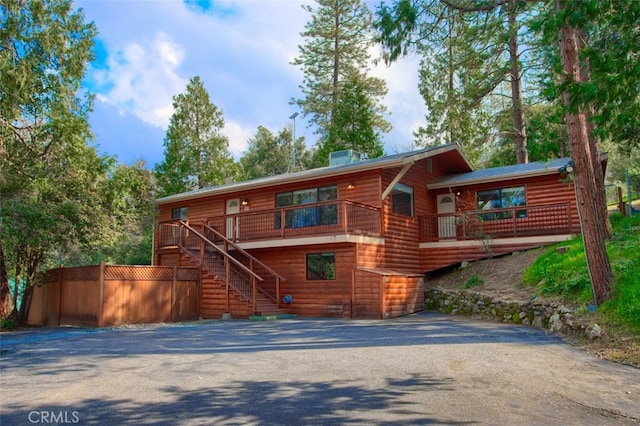 log cabin with a deck