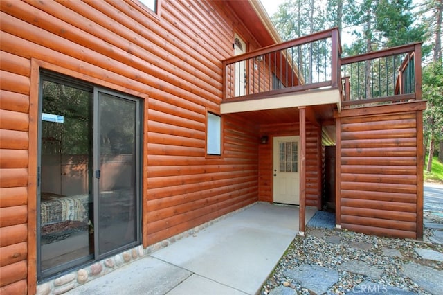 doorway to property with a patio area and a balcony