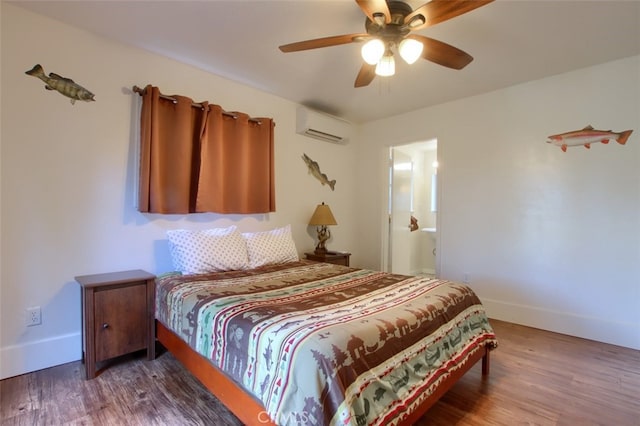 bedroom with hardwood / wood-style floors, a wall unit AC, and ceiling fan