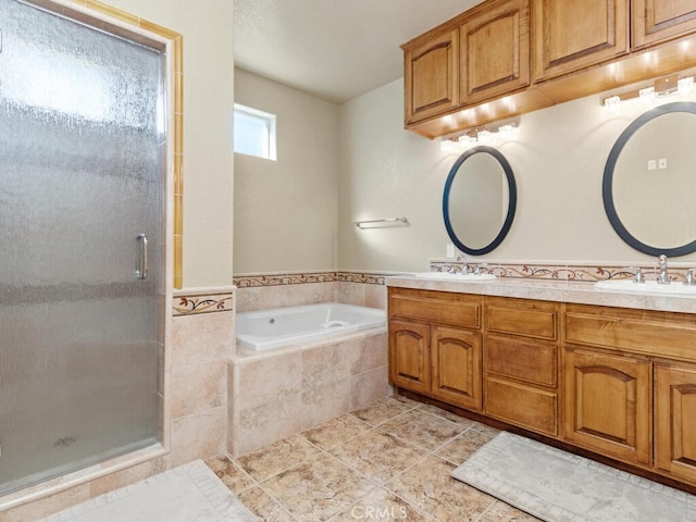 bathroom featuring shower with separate bathtub, vanity, and tile patterned floors