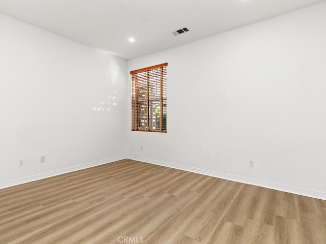 unfurnished room featuring light hardwood / wood-style floors