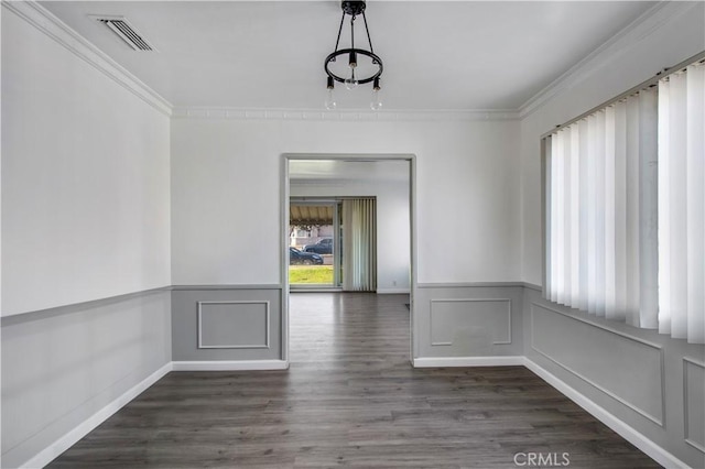 unfurnished dining area featuring dark hardwood / wood-style flooring and ornamental molding