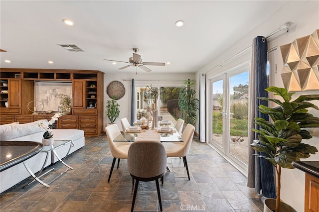 dining room featuring ceiling fan and french doors