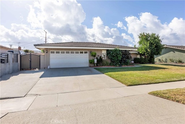 ranch-style home featuring a front yard and a garage