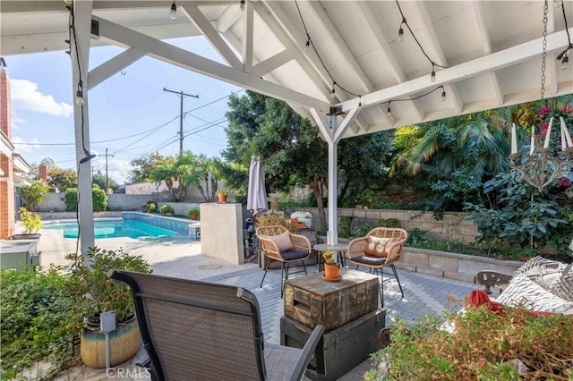 view of patio featuring a fenced in pool