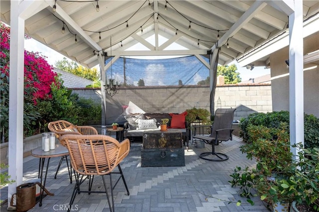 view of patio with outdoor lounge area and a gazebo