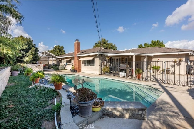 view of swimming pool featuring a patio area