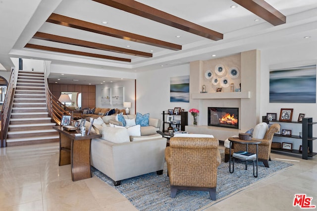 living room with beamed ceiling and light tile patterned floors