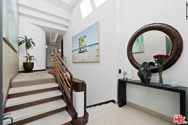 stairs featuring tile patterned flooring