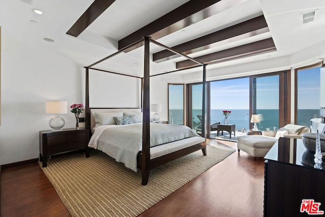 bedroom featuring a water view and dark hardwood / wood-style floors