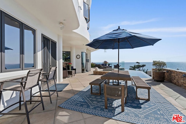 view of patio / terrace featuring a water view