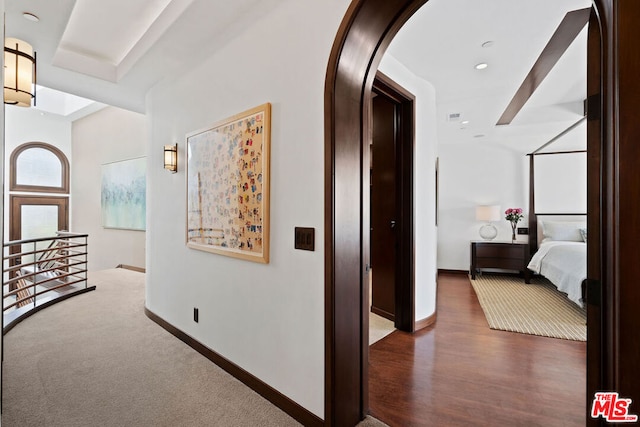 corridor featuring dark hardwood / wood-style flooring