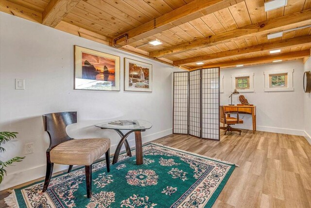 living area featuring wood ceiling, beam ceiling, and hardwood / wood-style flooring