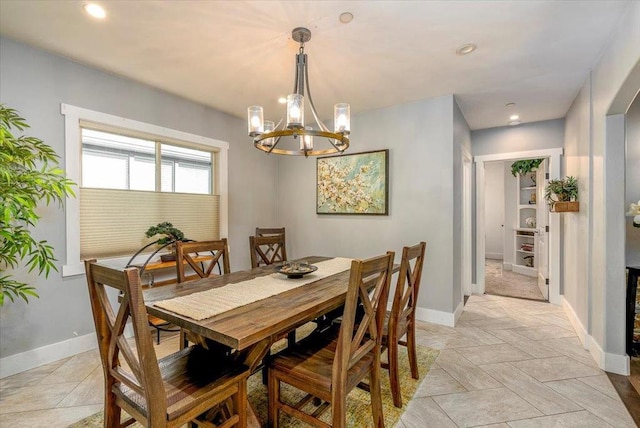 dining space with a notable chandelier