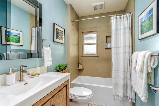 full bathroom featuring toilet, vanity, and shower / bathtub combination with curtain