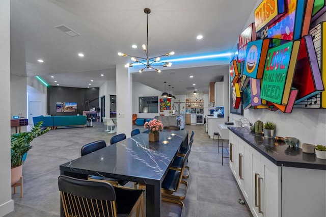 dining space with a chandelier