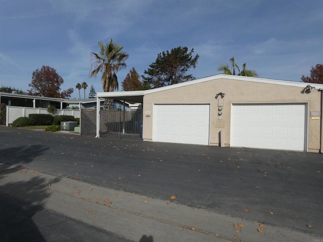 garage featuring a carport