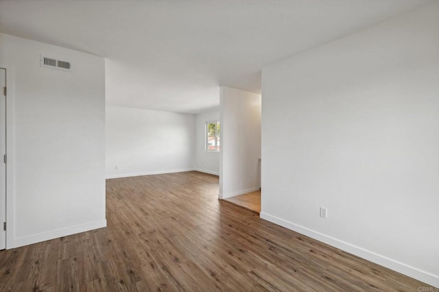 spare room featuring hardwood / wood-style flooring