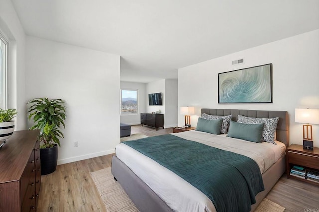 bedroom with light hardwood / wood-style floors