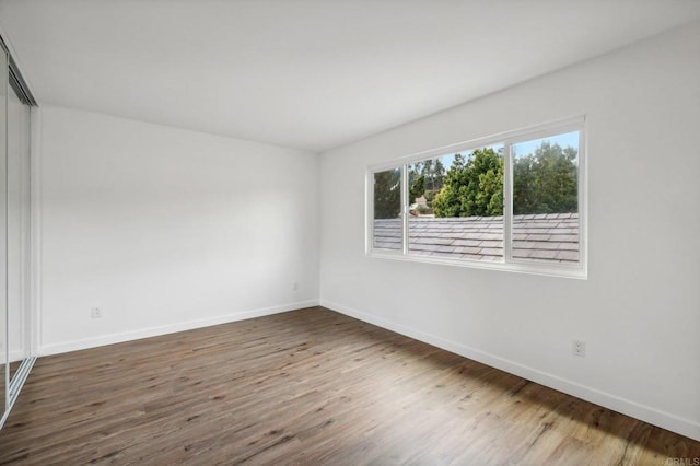 spare room featuring dark hardwood / wood-style floors