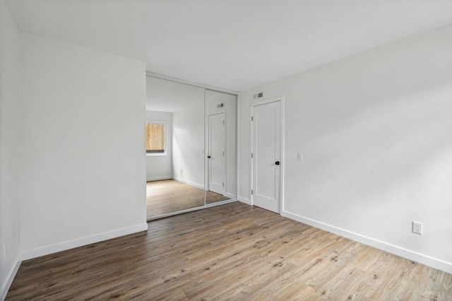 empty room featuring hardwood / wood-style flooring