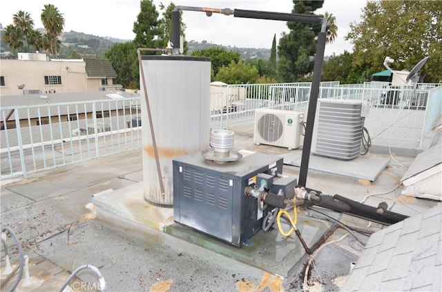 details with water heater, ac unit, and central AC unit