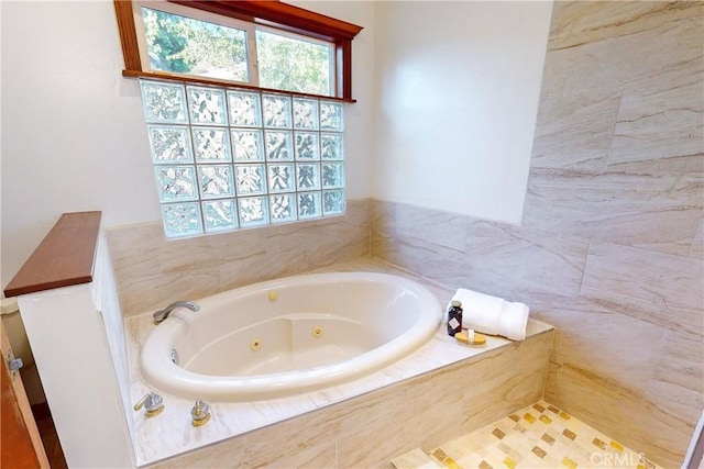 bathroom featuring tiled tub