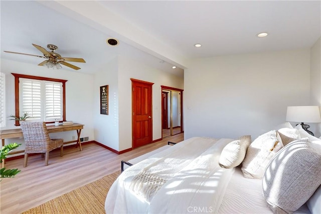 bedroom featuring light wood-type flooring and ceiling fan