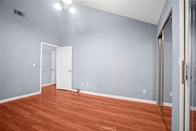 unfurnished bedroom with a closet and light hardwood / wood-style floors