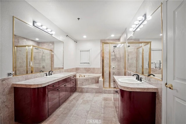 bathroom featuring tile patterned flooring, vanity, and shower with separate bathtub