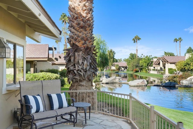 balcony featuring a water view