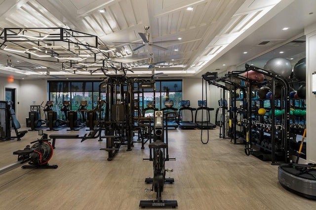 exercise room with hardwood / wood-style flooring and ceiling fan