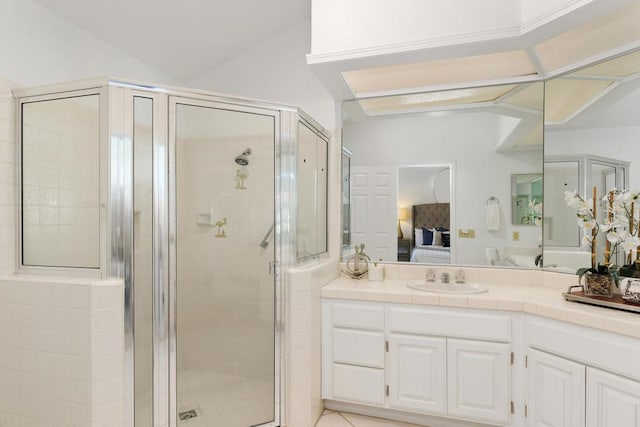 bathroom featuring vanity, a shower with shower door, and lofted ceiling