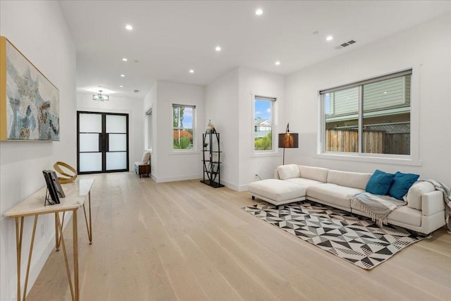 living room with light hardwood / wood-style floors