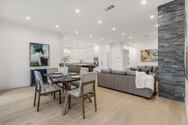 dining area with light wood-type flooring