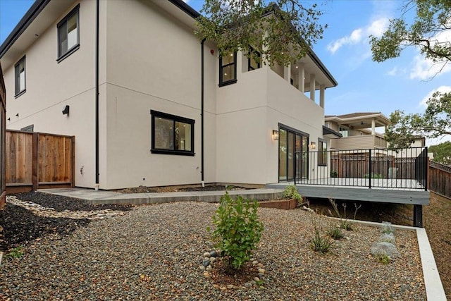 rear view of house with a deck