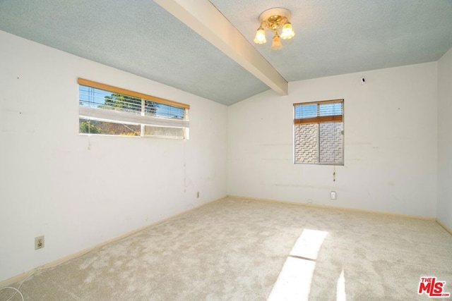 unfurnished room featuring carpet flooring, lofted ceiling with beams, and a textured ceiling