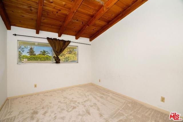 carpeted spare room with vaulted ceiling with beams and wood ceiling