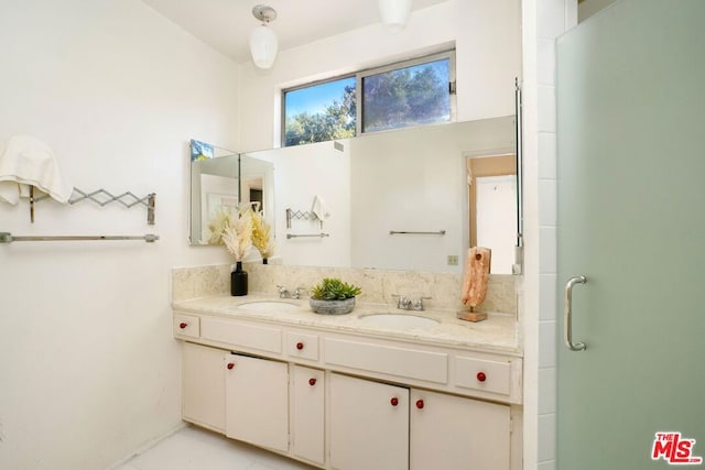 bathroom with vanity and walk in shower