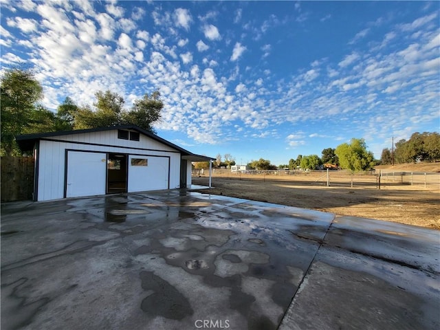 garage featuring a rural view