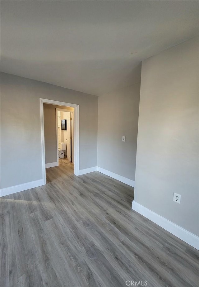 spare room with light wood-type flooring