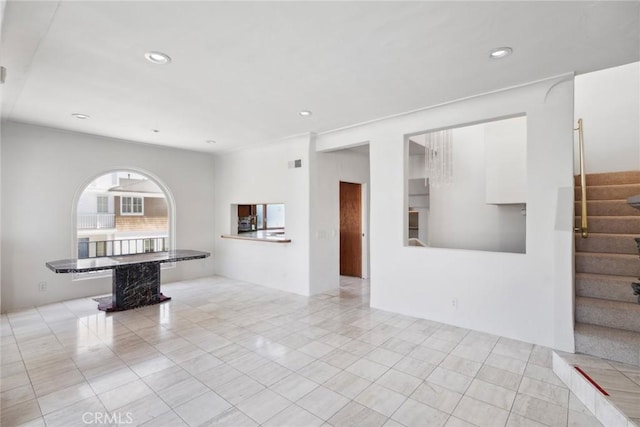 unfurnished room featuring light tile patterned floors