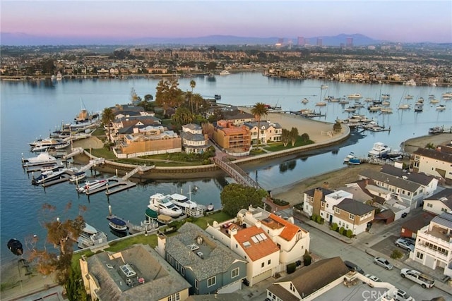 aerial view at dusk with a water view