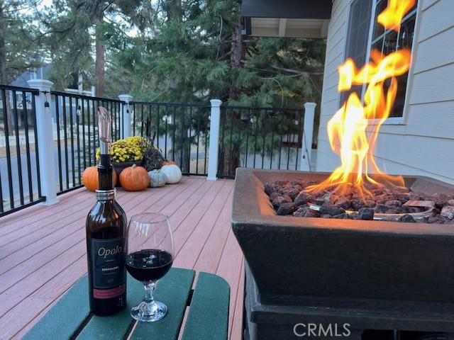 deck with an outdoor fire pit