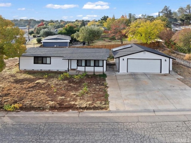 ranch-style home featuring a garage