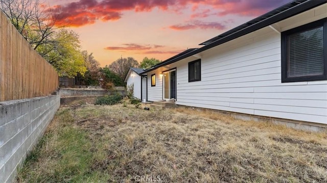 view of yard at dusk