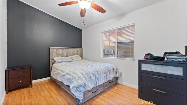 bedroom featuring light wood-type flooring and ceiling fan