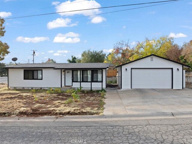 ranch-style house featuring an outbuilding and a garage